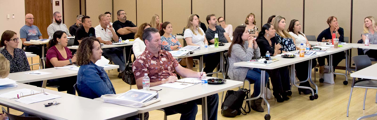 Faculty sitting in a conference room