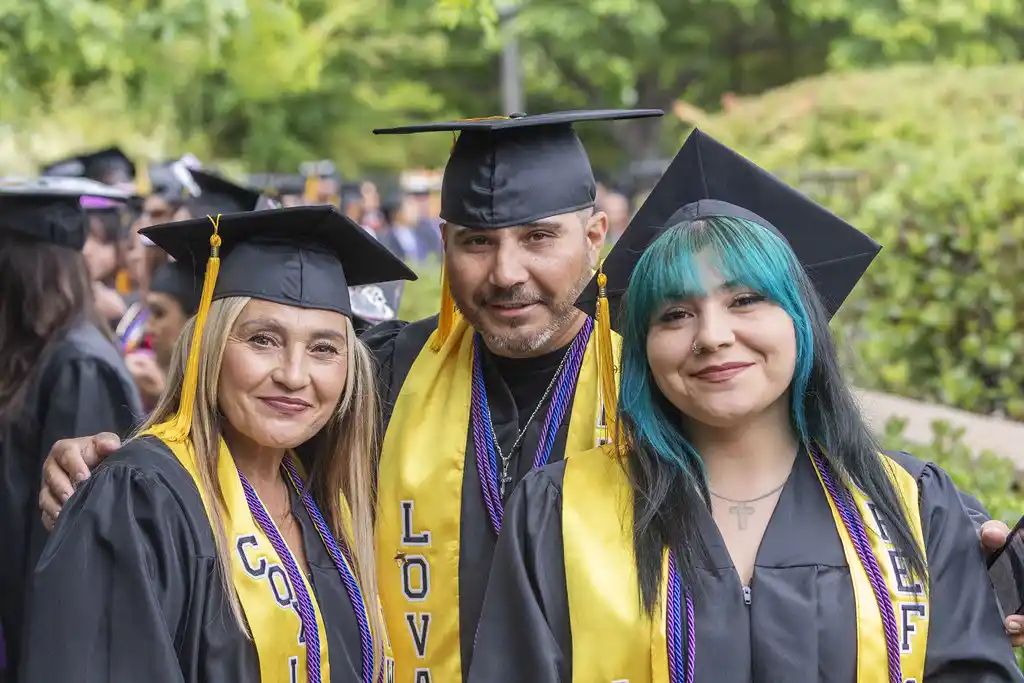 A family of graduates celebrate during the 2025 SDCCE and SDUSD Joint Commencement Ceremony.