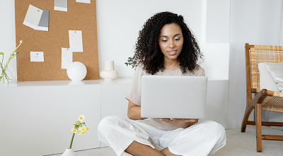 Woman sitting on a laptop