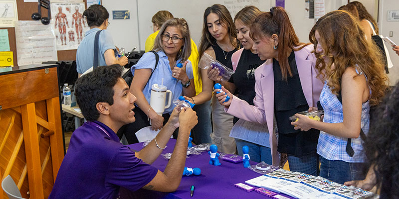 Students around a table at an event